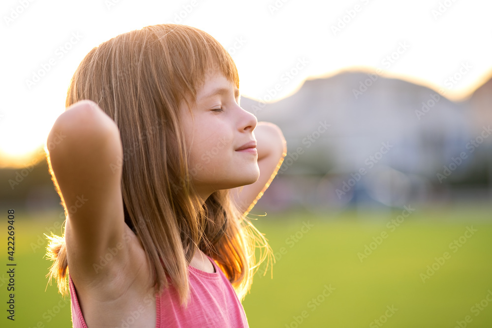 Portrait of young pretty child girl relaxing outdoors on warm summer day. Portrait of young pretty child girl relaxing outdoors on warm summer day.