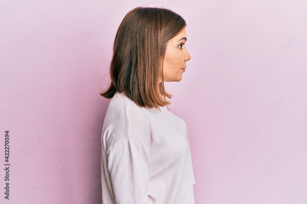 Young beautiful woman wearing casual clothes looking to side, relax profile pose with natural face with confident smile. Young beautiful woman wearing casual clothes looking to side, relax profile pose with natural face with confident smile.