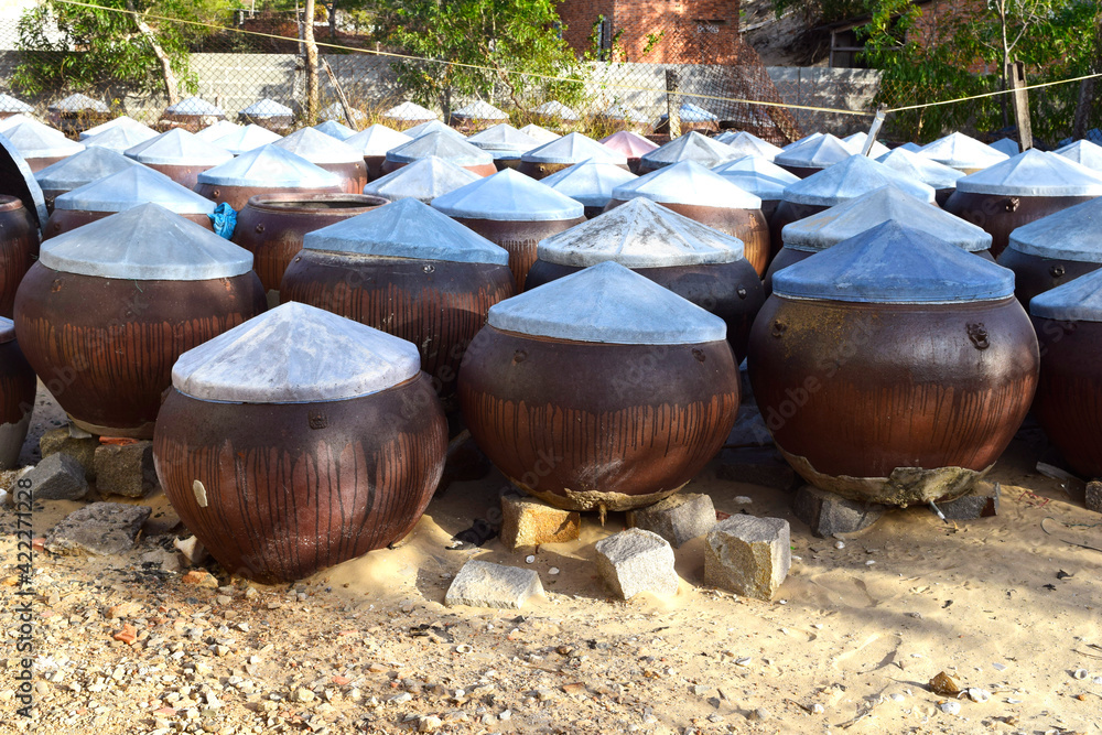 Making fish sauce in Asia. Culinary features of Vietnam Making fish sauce in Asia. Culinary features of Vietnam