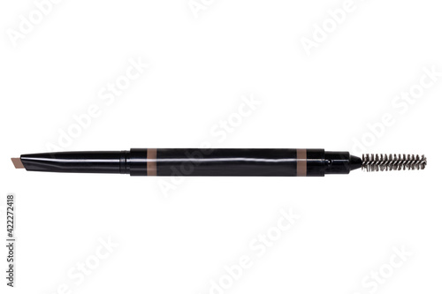 Cosmetic tools. Macro photograph of a slanted professional eyebrow pencil and brush isolated on a white background.
