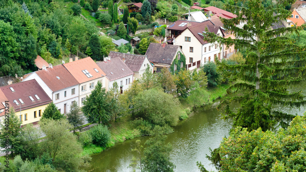 Houses lined up next to a river in Tabor, Czech Republic
