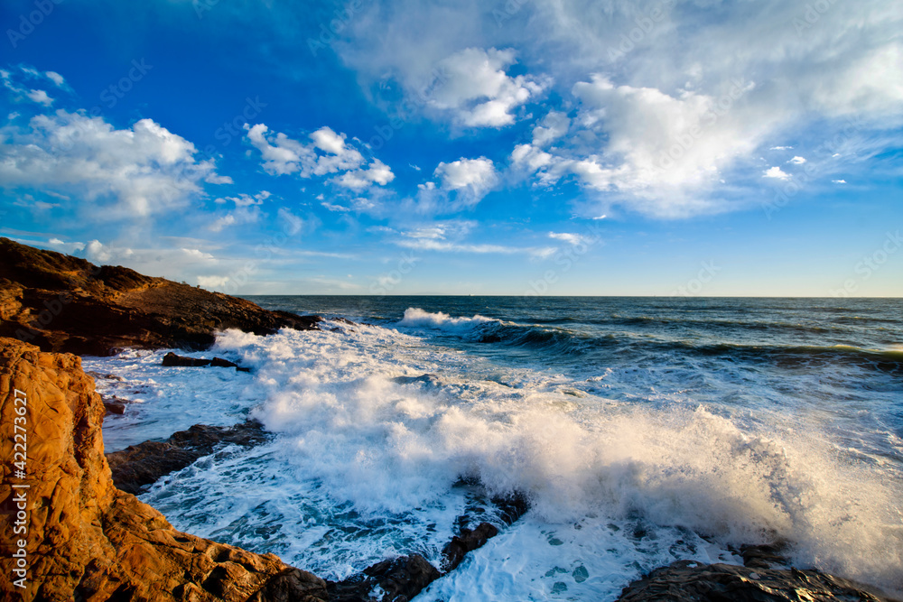 A rocky ocean coast with crashing waves