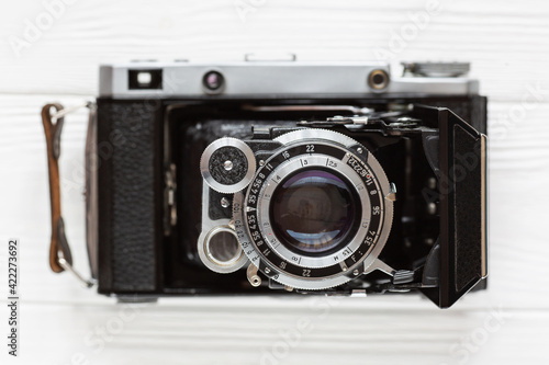 Retro range finder film camera top view on white background