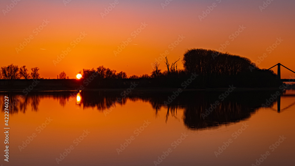Beautiful sunset with reflections near Metten, Danube, Bavaria, Germany