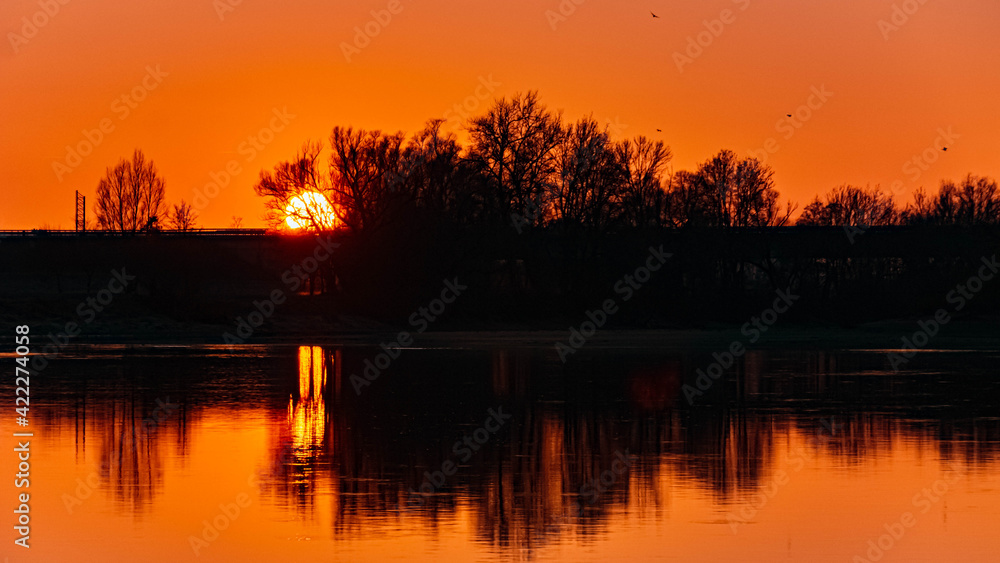 Beautiful sunset with reflections near Metten, Danube, Bavaria, Germany