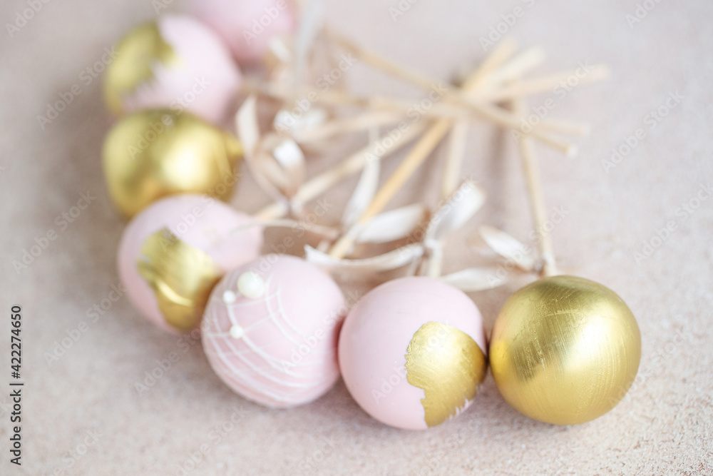 The pastry chef decorates cake pops with satin ribbons.Various cake pops decorated with white and dark chocolate on a brown background. High quality photo. The pastry chef decorates cake pops with satin ribbons.Various cake pops decorated with white and dark chocolate on a brown background. High quality photo.
