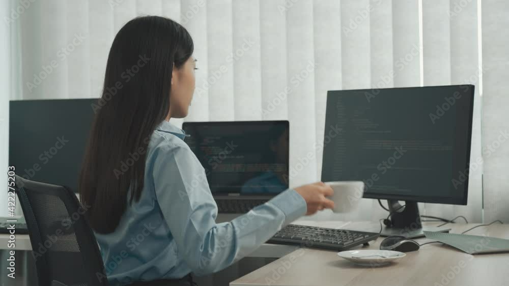 Asian software developers are sitting and working in the morning. Asian software developers are sitting and working in the morning.