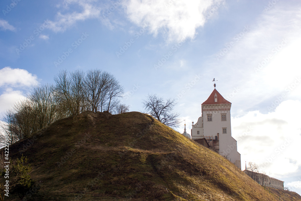 Grodno. Belarus. Spring landscape with an old restored castle located on a high hill.