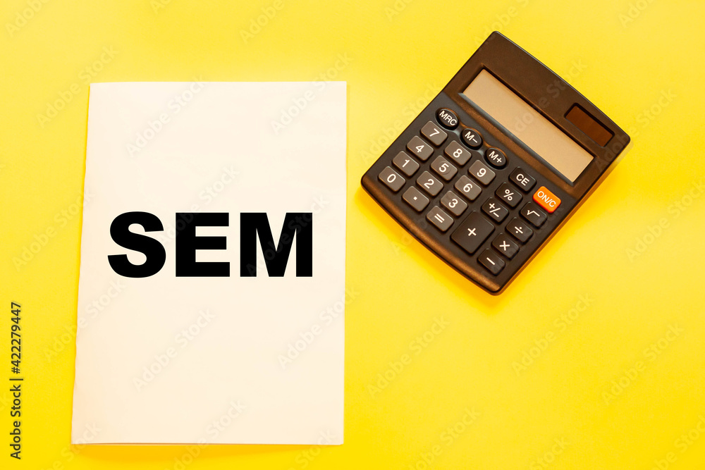 SEM on yellow background in office desk SEM on yellow background in office desk
