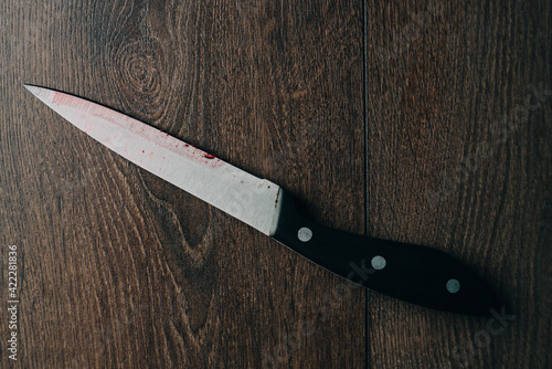 knife on a wooden table close-up kitchen background image