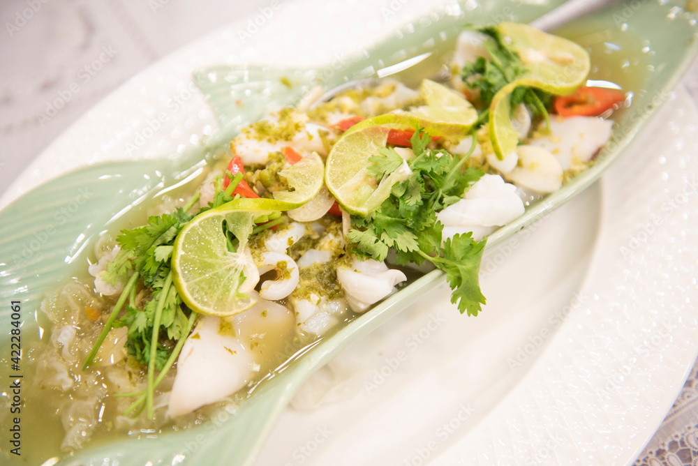 Steamed Squid with Lemon, hot and spicy squid steamed with lime - Thai food Steamed Squid with Lemon, hot and spicy squid steamed with lime - Thai food