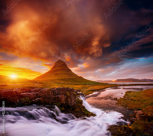 Incredible photo of Kirkjufellsfoss waterfall at sunset. Location famous place Kirkjufell volcano, Iceland, Europe.