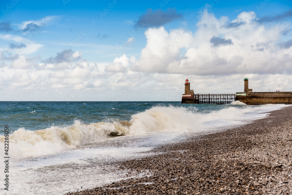 Lighthouses and guidance at the entrance of the Port of Fecamp, Normandy, France, Europe on the coast of Normandy in the English Channel in Autumn. Seascape with waves.