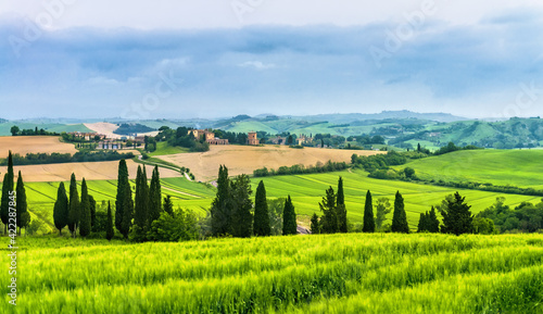 Farm on urvy hills in Tuscany
