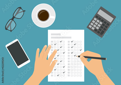 Flat design illustration of a man or woman's hand filling out a professional test answer form with a pencil. Cup of coffee with calculator and glasses on green background, vector