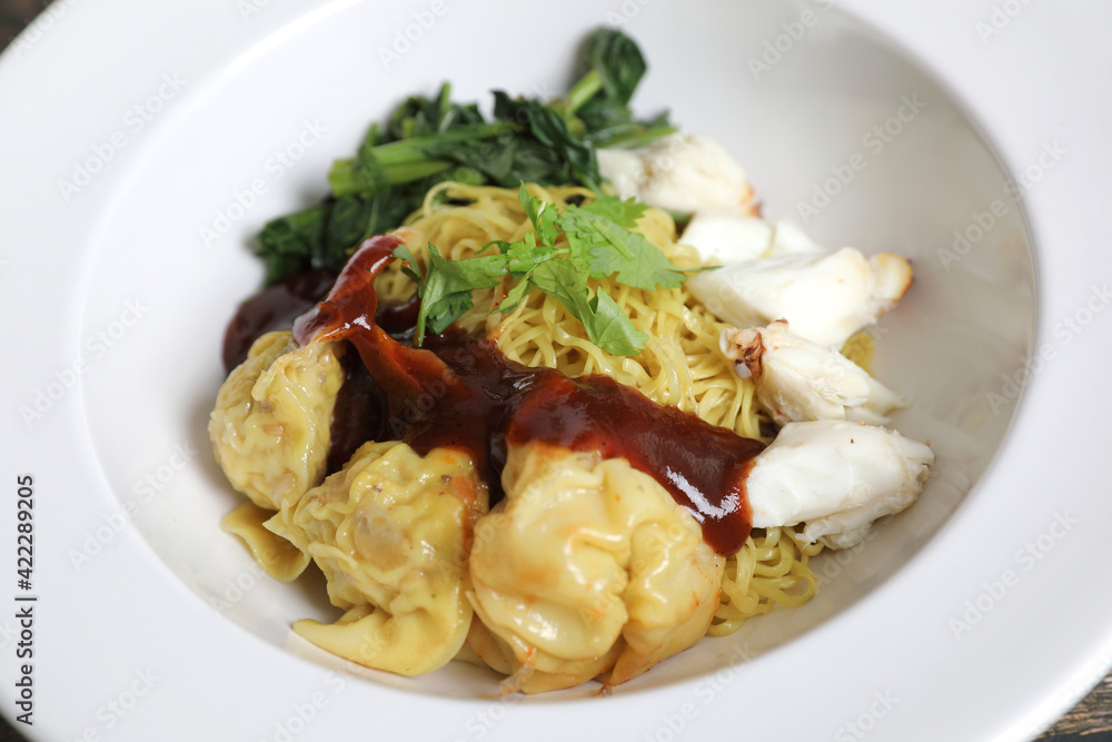 Shrimp dumpling noodles and crab meat on wood background Shrimp dumpling noodles and crab meat on wood background