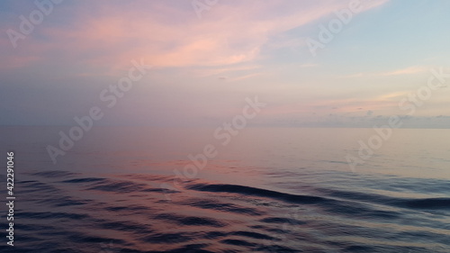 fog over the ocean and pink sunset. pacific ocean, equatorial zone