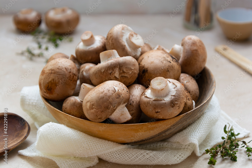Champignons uncooked, cooking ingredients for a mushroom soup Champignons uncooked, cooking ingredients for a mushroom soup