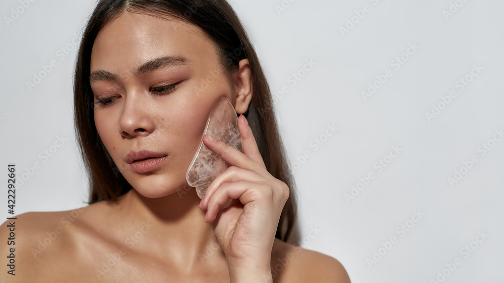 Beautiful model with facial massager Beautiful model with facial massager