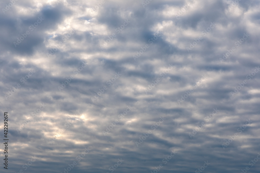 Obraz premium White cloud flying on blue sky with warm color sunlight as texture and background