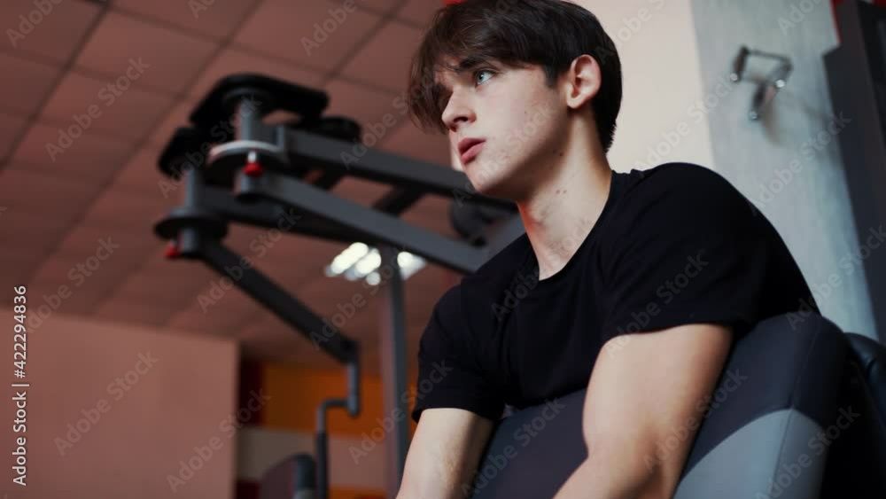 Caucasian power athletic man training pumping up biceps muscles. Fitness and bodybuilding concept Caucasian power athletic man training pumping up biceps muscles. Fitness and bodybuilding concept