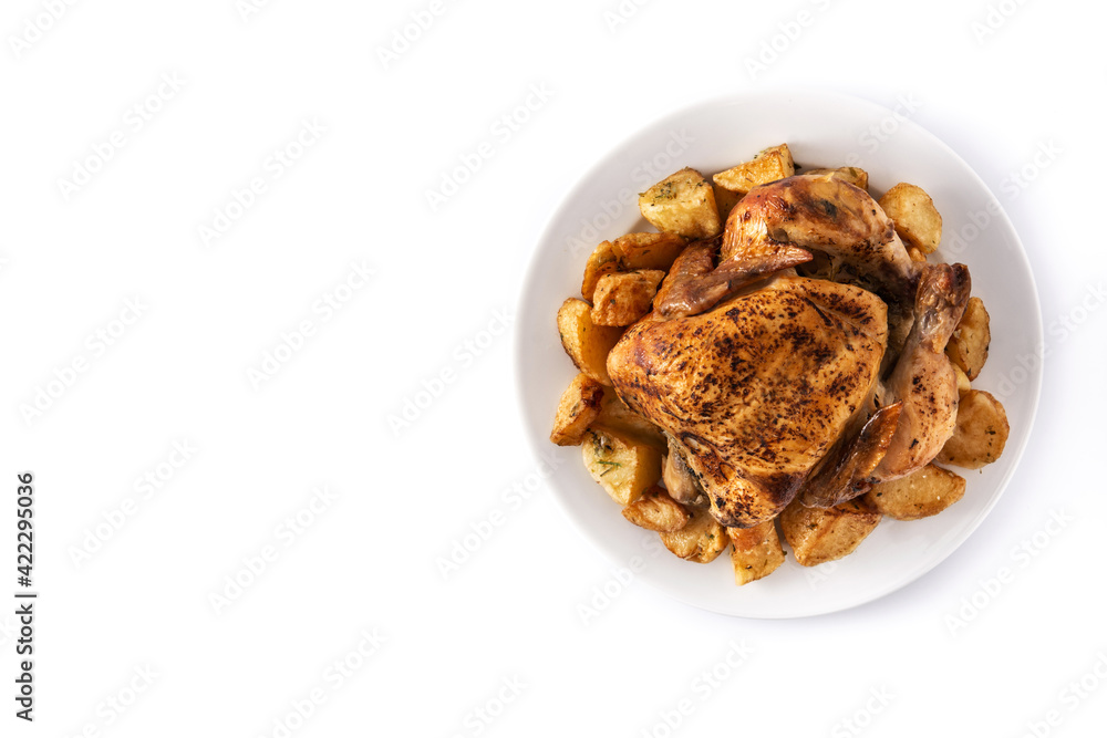 Homemade roasted chicken with potatoes isolated on white background. Top view. Copy space