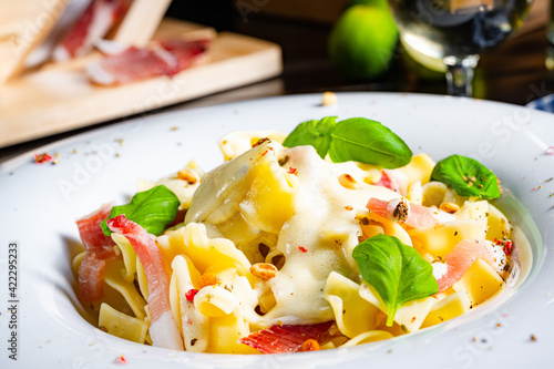 Tagliatelle with gorgonzola masarpone sauce and ham. photo