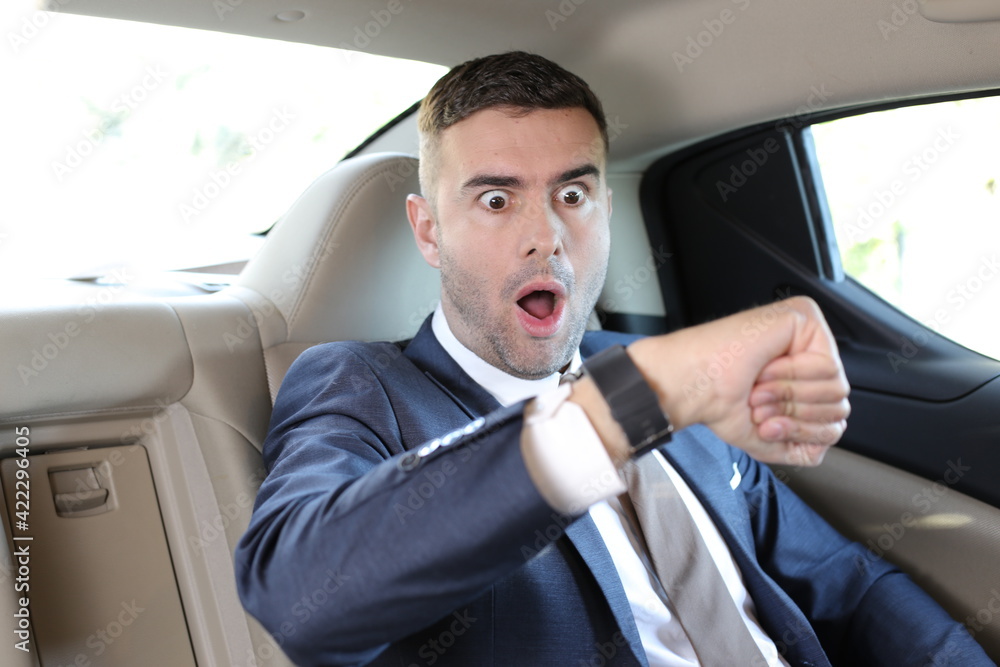 Stressed out businessman in taxi