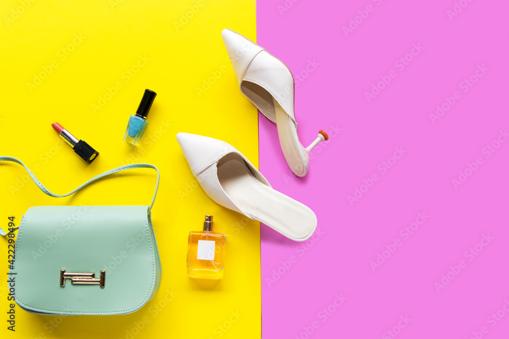 Fashion bag and shoe woman accessories pastel background. Trendy fashion luxury handbag, shoe, perfume and cosmetic design Fashion bag and shoe woman accessories pastel background. Trendy fashion luxury handbag, shoe, perfume and cosmetic design