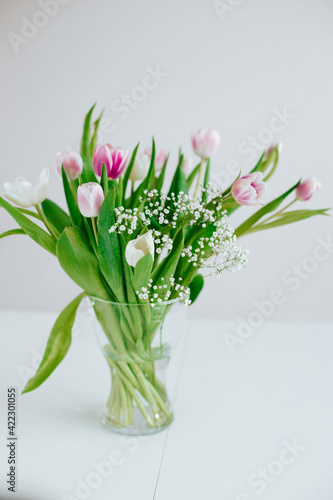 Spring tulips in vase white nordic minimalistic look for Instagram or other social media