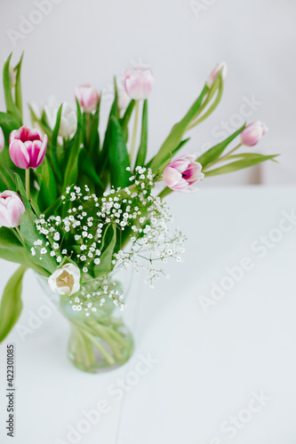 Spring tulips in vase white nordic minimalistic look for Instagram or other social media