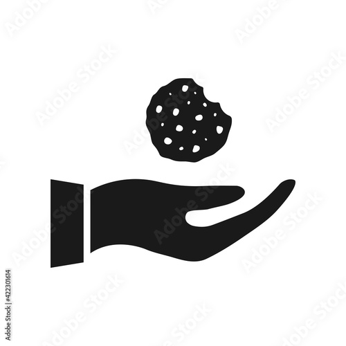 Hand giving cookie icon. Open hand with chocolate tasty chip. Black silhouette. Food concept. Vector isolated on white