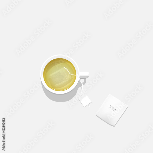 white cup with tea bag on white isolated background