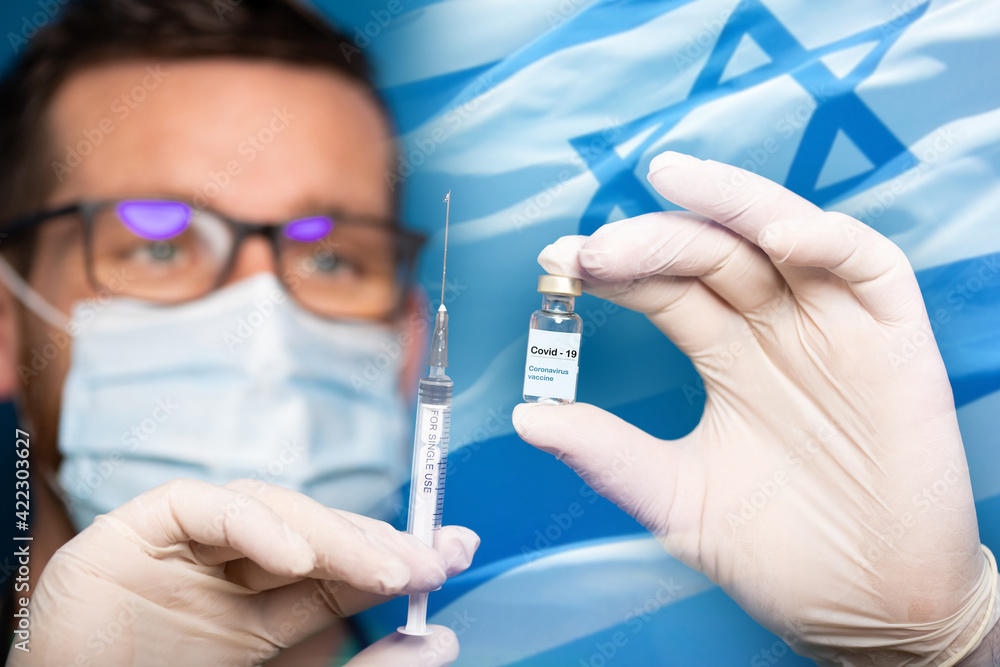 coronavirus vaccine israel flag and doctor preparing to give vaccine coronavirus vaccine israel flag and doctor preparing to give vaccine