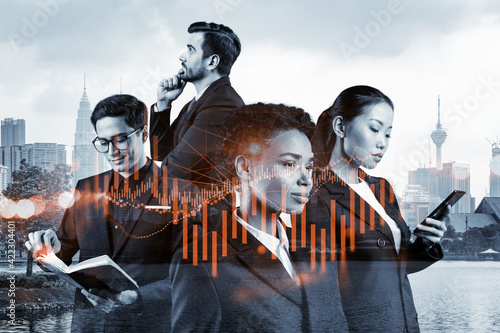 Photography Group of business colleagues in suits as a part of multinational corporate team working on forecasting trading corporate strategy at fund