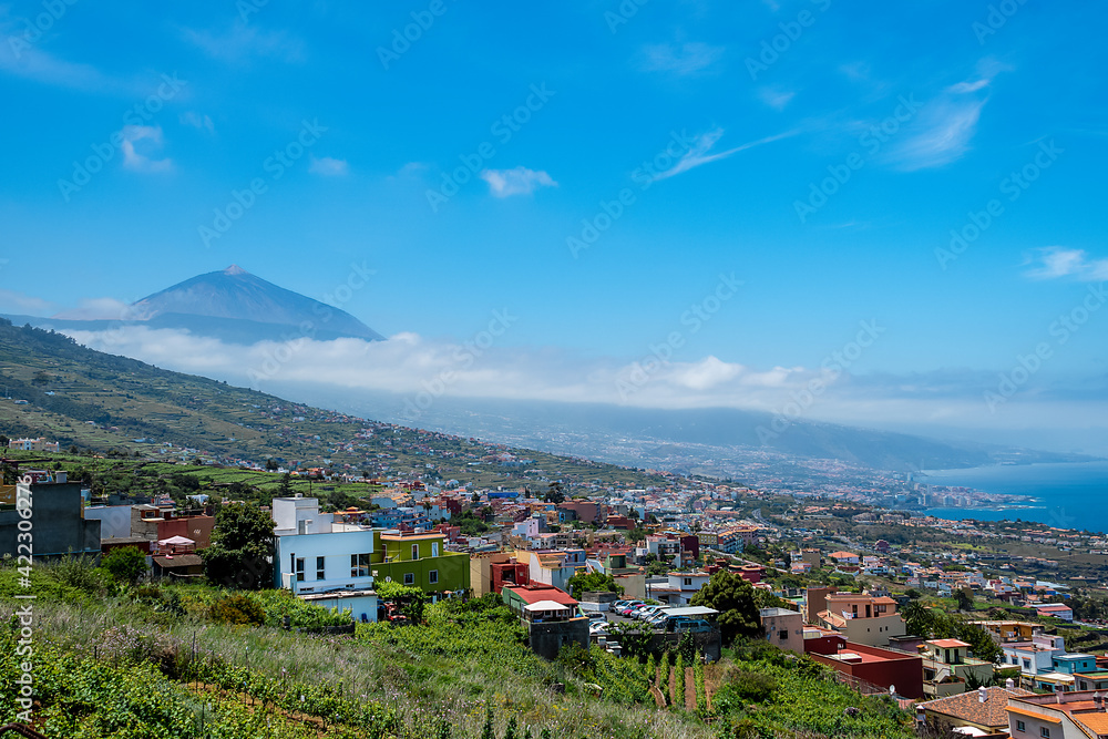 Panoramic view of Tenerife island with Puerto de la Cruz City and the volcano Teide  on a sunny day. Canary Islands.