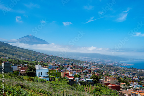 Panoramic view of Tenerife island with Puerto de la Cruz City and the volcano Teide on a sunny day. Canary Islands.