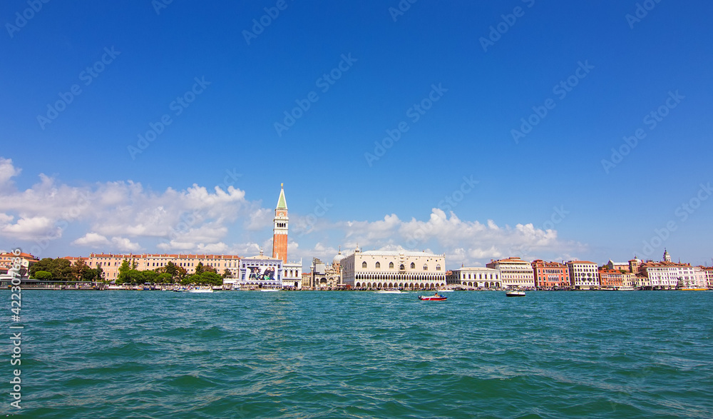 Fototapeta premium The historical Doge's palace and Campanile of Saint Mark's Cathedral on Piazza di San Marco, view from the the Grand Canale in Venice, Italy. Italian buildings cityscape. Famous romantic city on water
