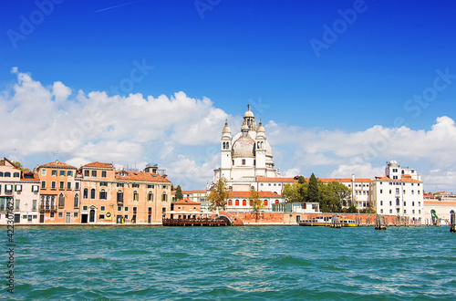Basilica di Santa Maria della Salute (also known as The Basilica of St Mary of Health), view from the the Grand Canale in Venice, Italy. Italian buildings cityscape. Famous romantic city on water