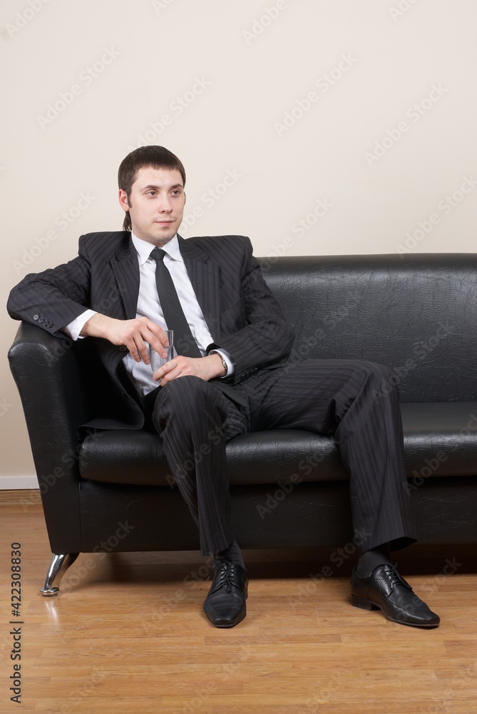 Portrait of a businessman sitting on a couch Portrait of a businessman sitting on a couch