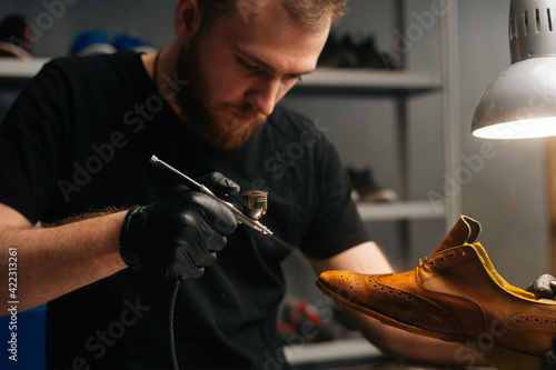 Premium Photo Front View Of Hands Of Shoemaker Shoemaker In Black Gloves  Holding Old Worn Light