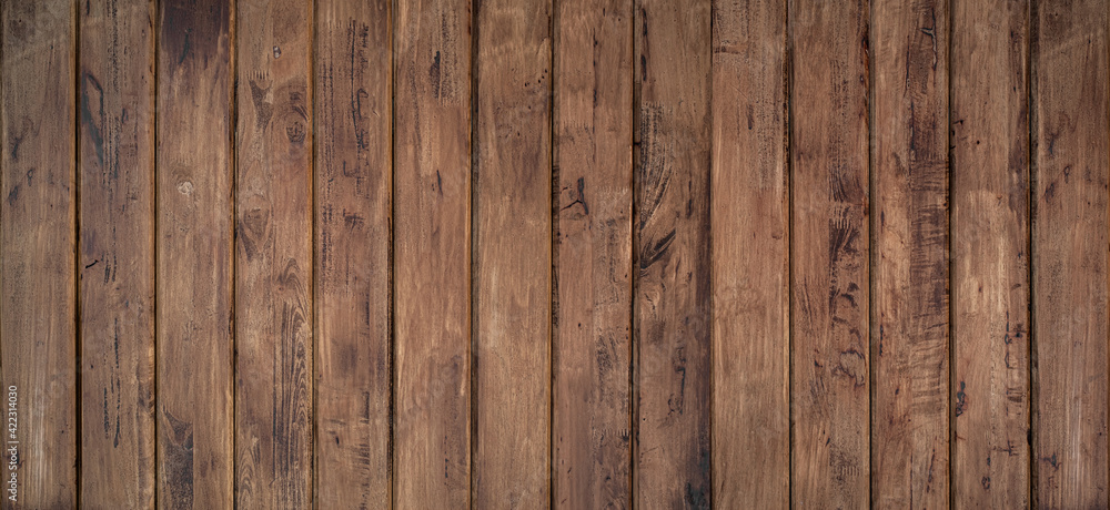 Brown wood texture background coming from natural tree. The wooden panel has a beautiful dark pattern, hardwood floor texture