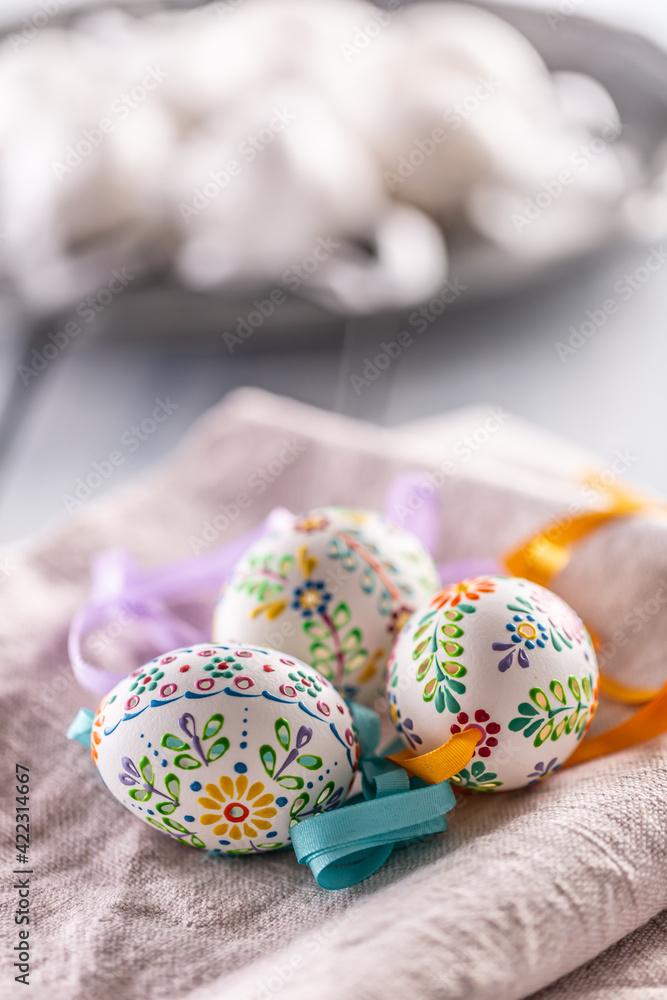 Fototapeta premium Handmade colorful easter eggs on a linen napkin
