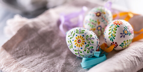 Handmade colorful easter eggs on a linen napkin