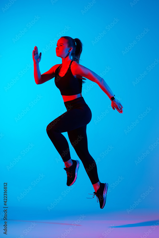 Young athletic woman is doing sport.