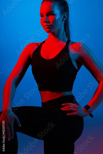 Young athletic woman is doing sport.