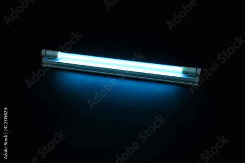 Photos Modern ultraviolet lamp glowing on black background