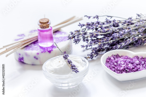 lavender flowers in organic cosmetic set on white background