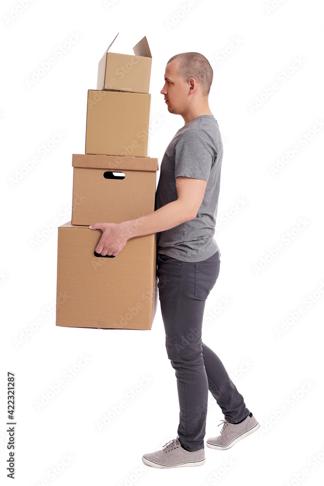 side view of man holding heap of boxes in hands isolated on white background. side view of man holding heap of boxes in hands isolated on white background.