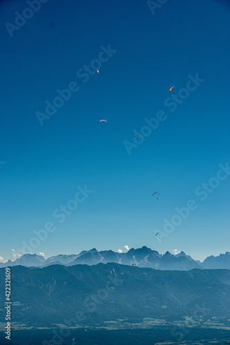 Paragliders flying above Mt. Gerlitzen